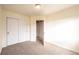 Spacious bedroom with double door closet and access to hallway at 911 Snowberry St, Longmont, CO 80503