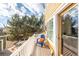 Private deck with blue chair and view of trees at 911 Snowberry St, Longmont, CO 80503