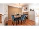 Elegant dining area featuring hardwood floors and a fireplace at 911 Snowberry St, Longmont, CO 80503