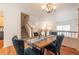 Spacious dining area with hardwood floors and a staircase view at 911 Snowberry St, Longmont, CO 80503