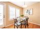 Bright dining area with glass top table and four chairs at 911 Snowberry St, Longmont, CO 80503