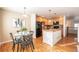 Charming dining area with glass table and four chairs at 911 Snowberry St, Longmont, CO 80503