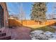 Landscaped backyard with patio and wooden fence at 2068 Jasmine St, Denver, CO 80207