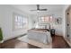 Cozy bedroom with ceiling fan, hardwood floors, and ample natural light at 2068 Jasmine St, Denver, CO 80207