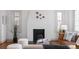 Modern living room with a white fireplace and dark hearth at 2068 Jasmine St, Denver, CO 80207