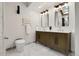 Bright bathroom with double vanity, modern fixtures, stylish mirrors, and a toilet with advanced features, all on a marble floor at 8782 S Ault Ln, Morrison, CO 80465