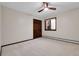 Neutral bedroom with a ceiling fan, lots of natural light, large closet and carpet flooring at 8782 S Ault Ln, Morrison, CO 80465