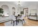 Dining room featuring hardwood floors, modern light fixtures, and neutral paint colors at 8782 S Ault Ln, Morrison, CO 80465