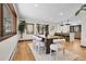 Spacious dining area with hardwood floors, modern lighting, and open access to kitchen at 8782 S Ault Ln, Morrison, CO 80465