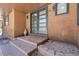 Charming home entrance with double doors and brick steps at 8782 S Ault Ln, Morrison, CO 80465