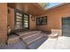 Charming home entrance with double doors and brick steps at 8782 S Ault Ln, Morrison, CO 80465
