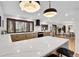 Open kitchen with a large island, modern lighting, and stainless steel appliances at 8782 S Ault Ln, Morrison, CO 80465