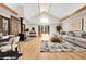 Inviting living room featuring a stone fireplace, skylight and window seat at 8782 S Ault Ln, Morrison, CO 80465