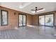 Enclosed patio featuring a ceiling fan, skylights and sliding glass doors to let the outside in at 8782 S Ault Ln, Morrison, CO 80465
