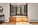 Bright window seat framed with windows offers a cozy space with exterior views at 8782 S Ault Ln, Morrison, CO 80465