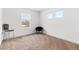 An empty bedroom featuring a chair near a window at 13328 Xanthia St, Thornton, CO 80602