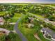 Gorgeous aerial view of the neighborhood homes, with mature landscaping and curved paved roads at 17053 E Jamison Ave, Centennial, CO 80016