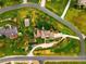 Stunning aerial view showcasing the property's lush landscaping, circular driveway, and overall layout at 17053 E Jamison Ave, Centennial, CO 80016