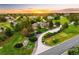 Scenic view of the neighborhood, highlighting its prime location, lush landscaping, and stunning sunset at 17053 E Jamison Ave, Centennial, CO 80016