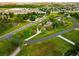 Aerial view of a neighborhood that features single-Gathering homes, paved roads, and green spaces at 17053 E Jamison Ave, Centennial, CO 80016
