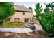 Brick home exterior with a hot tub and sliding glass door leading to the home at 17053 E Jamison Ave, Centennial, CO 80016