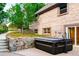 Backyard brick home exterior featuring a modern hot tub and stone walls for landscaping at 17053 E Jamison Ave, Centennial, CO 80016
