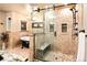 Beautiful bathroom with a clawfoot tub, glass shower, and decorative chandelier, offering a spa-like retreat at 17053 E Jamison Ave, Centennial, CO 80016