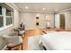 Spacious bedroom with wood floors, neutral tones, and an ensuite bathroom, offering comfort and convenience at 17053 E Jamison Ave, Centennial, CO 80016