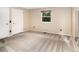 Clean and bright bedroom with neutral carpet, double closets, and a window offering ample natural light at 17053 E Jamison Ave, Centennial, CO 80016