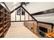 Charming bonus room with built-in bookshelves, a cozy fireplace, and an inviting loft space at 17053 E Jamison Ave, Centennial, CO 80016