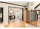 View of dining room through doorway with hardwood floors and elegant lighting at 17053 E Jamison Ave, Centennial, CO 80016