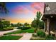 Scenic view of a home with well-maintained landscaping, brick walkway, and mature trees at 17053 E Jamison Ave, Centennial, CO 80016