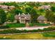 Charming exterior showcasing well-maintained landscaping, a stone facade, and classic architectural details at 17053 E Jamison Ave, Centennial, CO 80016