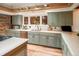 Well-appointed kitchen featuring stainless steel appliances and ample counter space at 17053 E Jamison Ave, Centennial, CO 80016