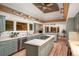 Spacious open concept kitchen with cooktop island and seating at 17053 E Jamison Ave, Centennial, CO 80016