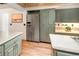 Kitchen with stainless steel appliances, light colored cabinetry, and lots of storage at 17053 E Jamison Ave, Centennial, CO 80016