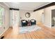 Cozy living room with hardwood floors, neutral walls, and dark wood trim at 17053 E Jamison Ave, Centennial, CO 80016