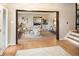 Open-concept living room with hardwood floors, neutral walls, and modern furnishings at 17053 E Jamison Ave, Centennial, CO 80016