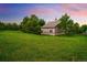 Charming outbuilding surrounded by lush greenery, blending seamlessly with the natural landscape at 17053 E Jamison Ave, Centennial, CO 80016