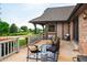 Outdoor patio area perfect for entertaining with seating and views of the landscaped backyard at 17053 E Jamison Ave, Centennial, CO 80016