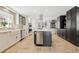 Spacious kitchen featuring stainless steel appliances, a center island, and ample counter space at 18 Club Ln, Littleton, CO 80123