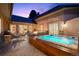 Back patio features a hot tub, fire pit, and built-in seating at 18 Club Ln, Littleton, CO 80123