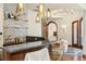 Stylish wet bar with unique tile work, pendant lights, and seating at 18 Club Ln, Littleton, CO 80123