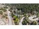 Picturesque aerial view shows mountain roads, greenery, and houses in a valley at 41 Silver Spruce, Boulder, CO 80302