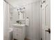 Cozy bathroom with white wooden walls, a modern vanity, and stylish lighting fixtures enhancing the bright space at 41 Silver Spruce, Boulder, CO 80302
