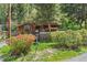 Exterior view of a home with beautiful flowerbeds and lush greenery at 41 Silver Spruce, Boulder, CO 80302