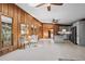 Open living space with skylight, dining space, stainless steel appliances, wood trim, and wood burning fireplace at 41 Silver Spruce, Boulder, CO 80302