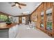 Open living and kitchen space featuring wood trim, skylights, eat in dining, and wood burning fireplace at 41 Silver Spruce, Boulder, CO 80302
