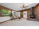 Bright open living space with wood burning fireplace, wood trim, large picture window and vaulted ceilings at 41 Silver Spruce, Boulder, CO 80302