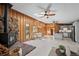 Open living space with wood burning fireplace, dining space, stainless appliances, skylight, and wood trim at 41 Silver Spruce, Boulder, CO 80302